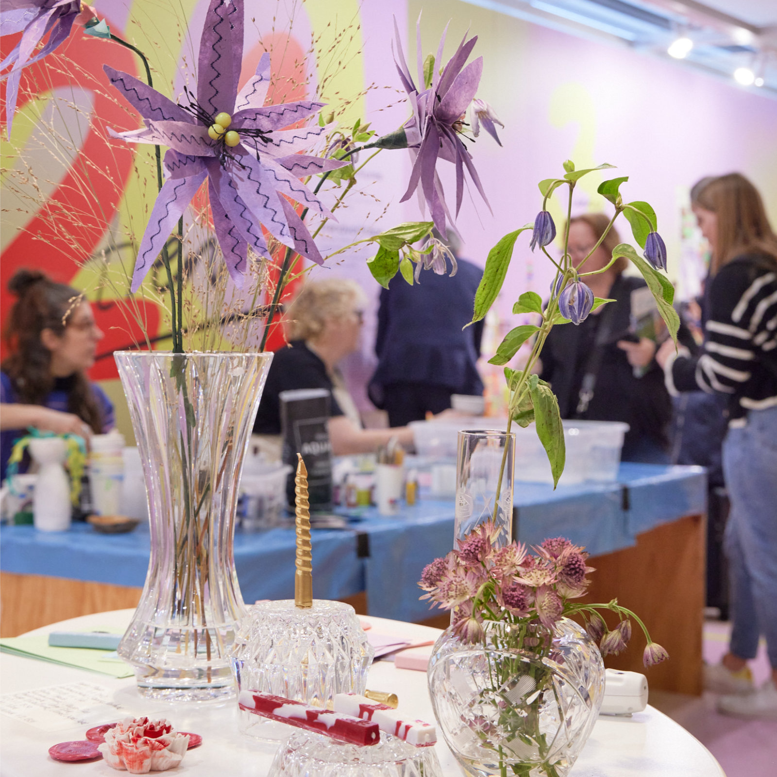 Crafted flowers in different vases at Creativeworld
