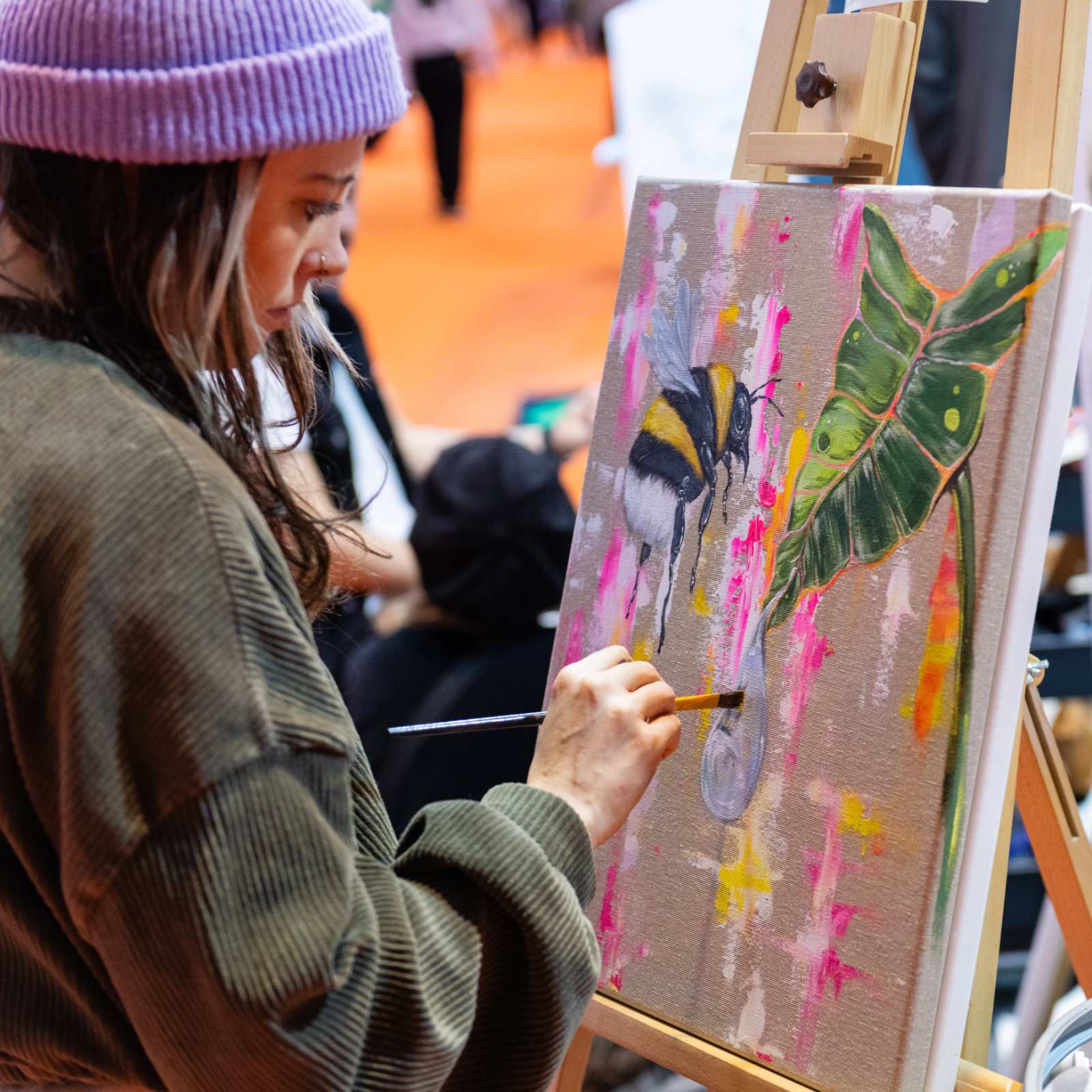 young woman is painting at Creativeworld
