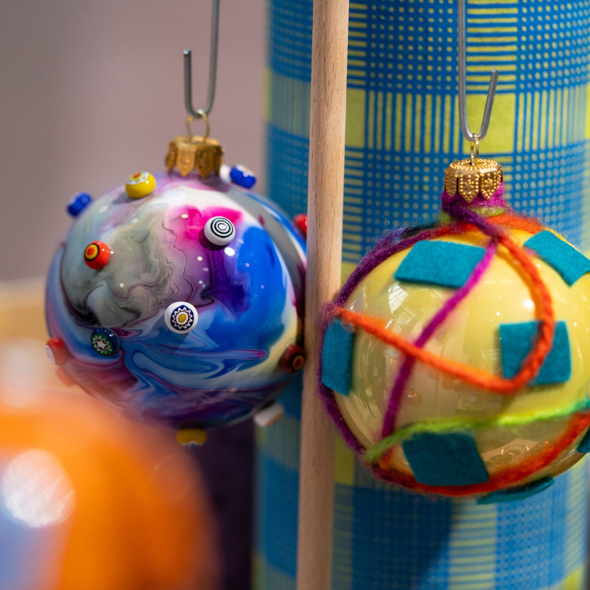 Two colourful Christmas baubles